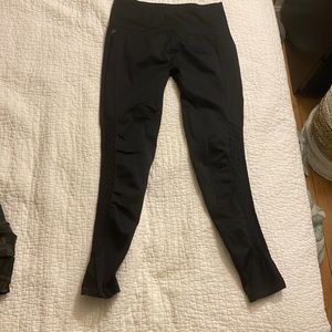 Fabletics Black leggings with design on legs. Size small.